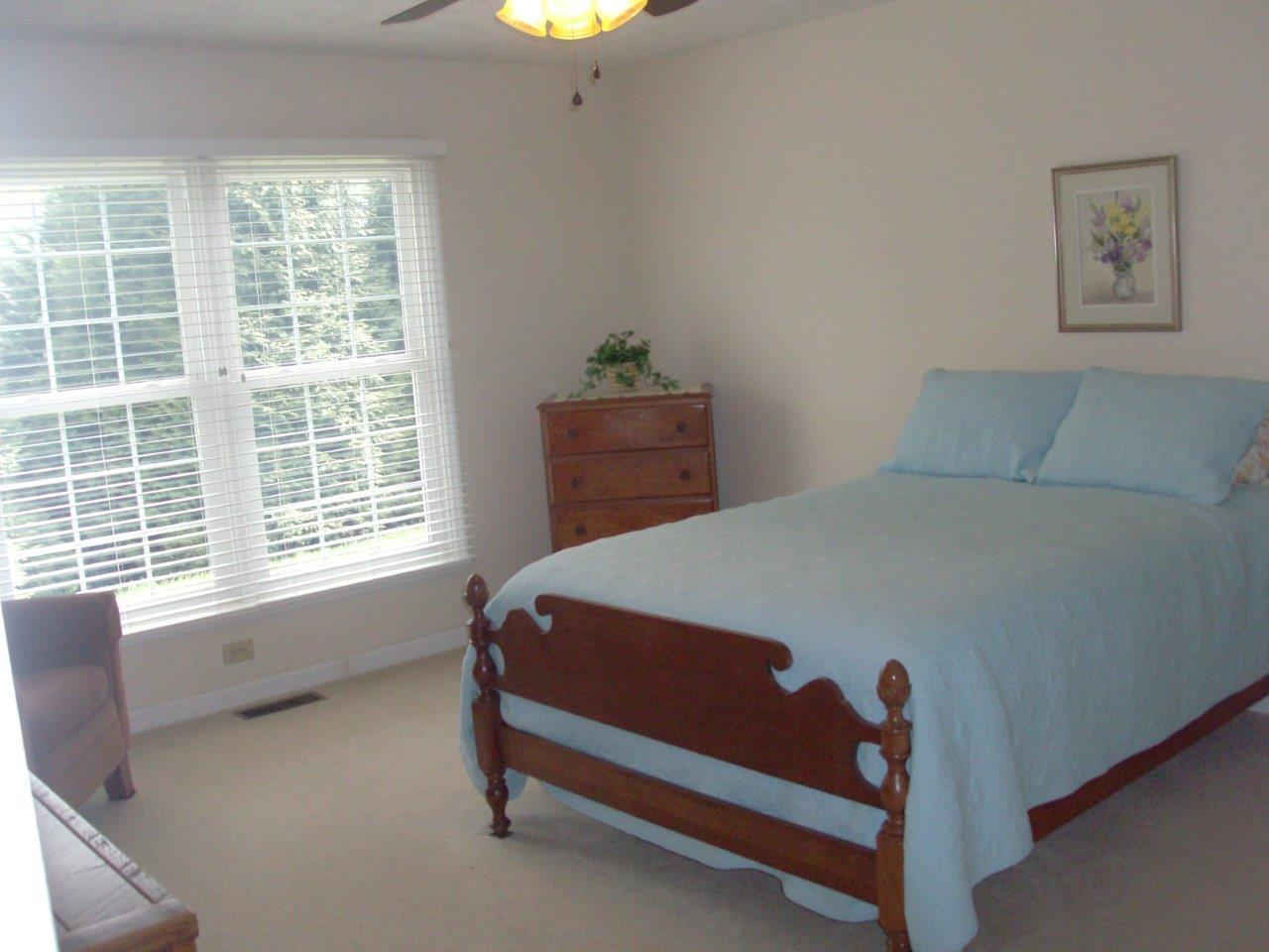 12929 Callaway Road Callaway, VA 24067 - Photo 3 of 59 a bed sitting in a bedroom next to a window