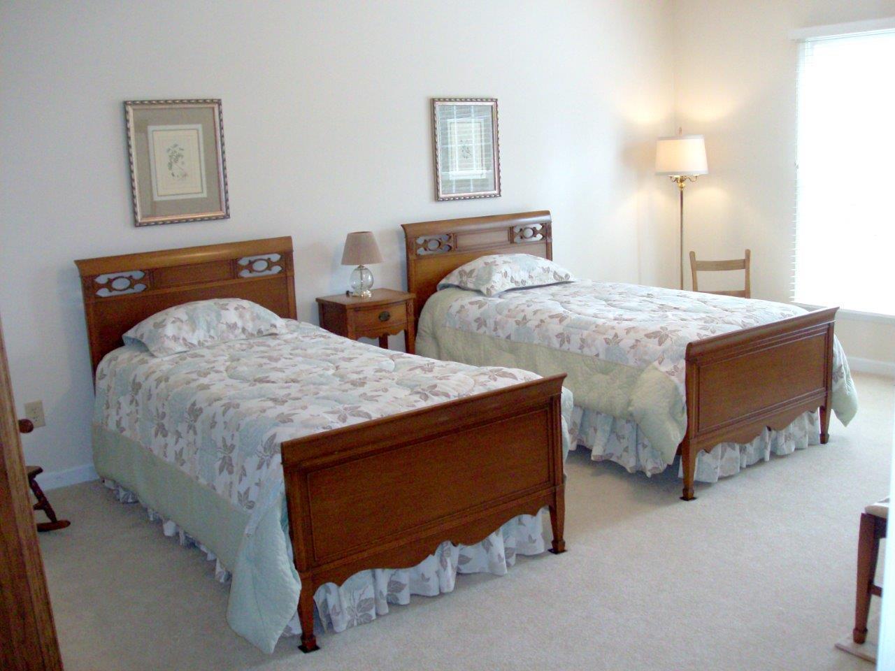 12929 Callaway Road Callaway, VA 24067 - Photo 4 of 59 a bedroom with two beds and painting on the wall