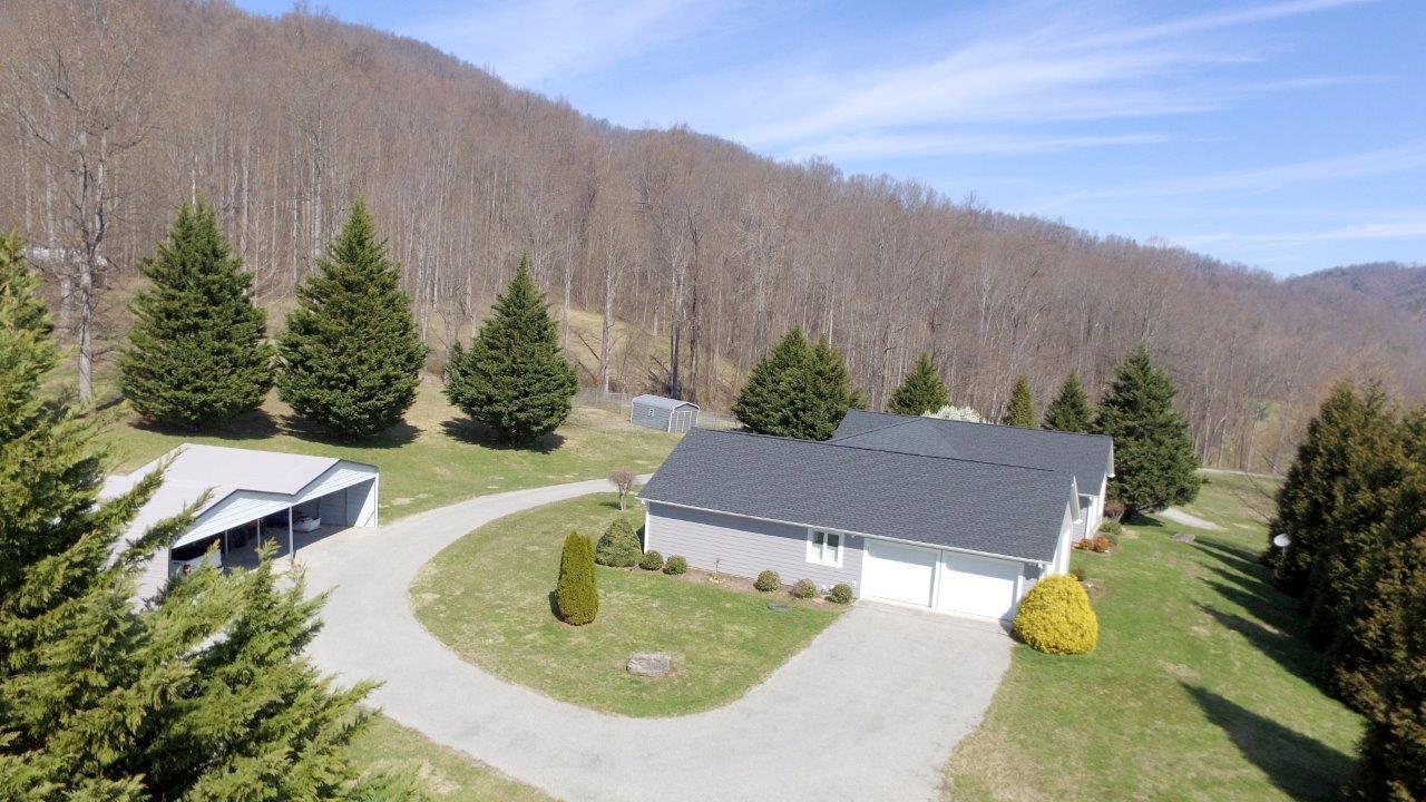 12929 Callaway Road Callaway, VA 24067 - Photo 46 of 59 an aerial view of a house with garden space and trees