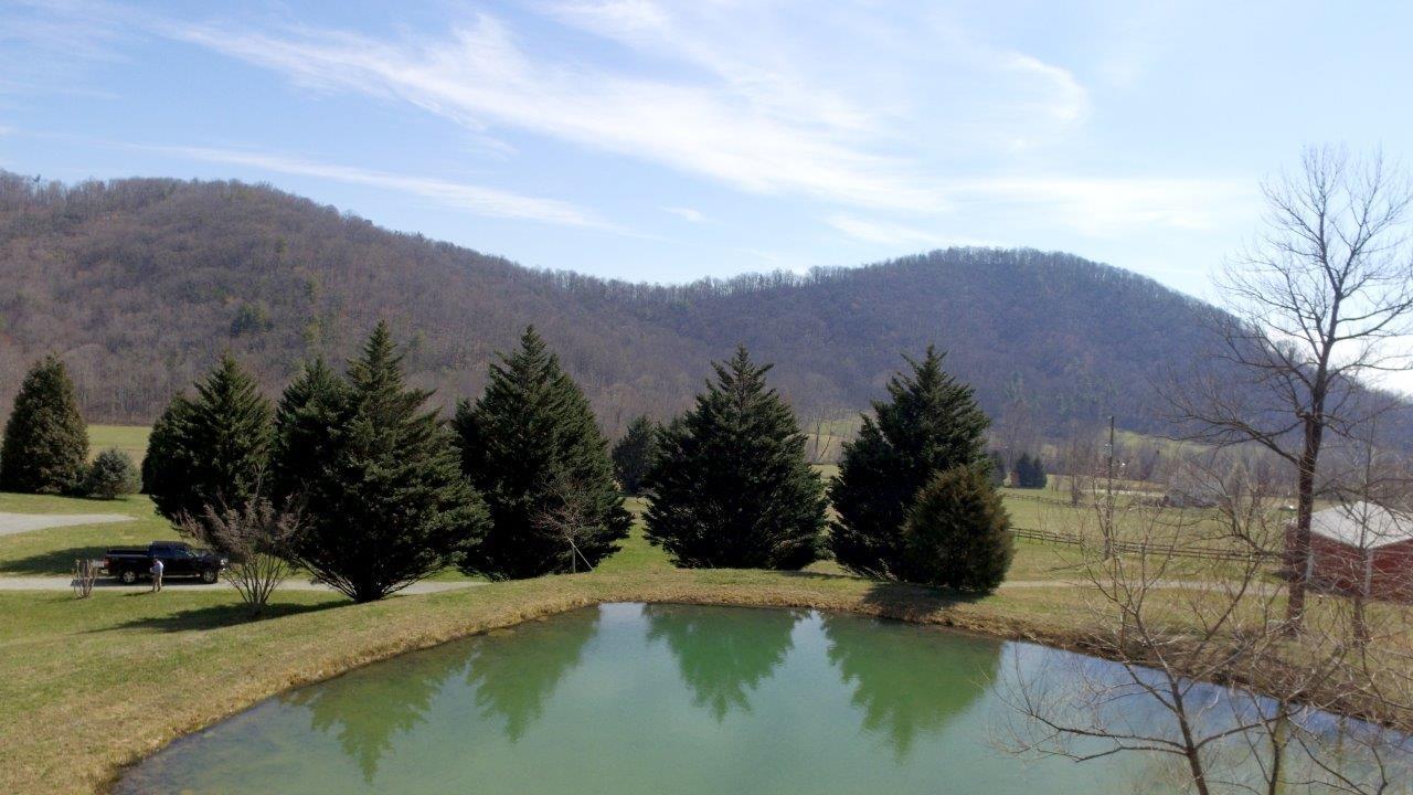 12929 Callaway Road Callaway, VA 24067 - Photo 48 of 59 a view of a lake with mountains in the background