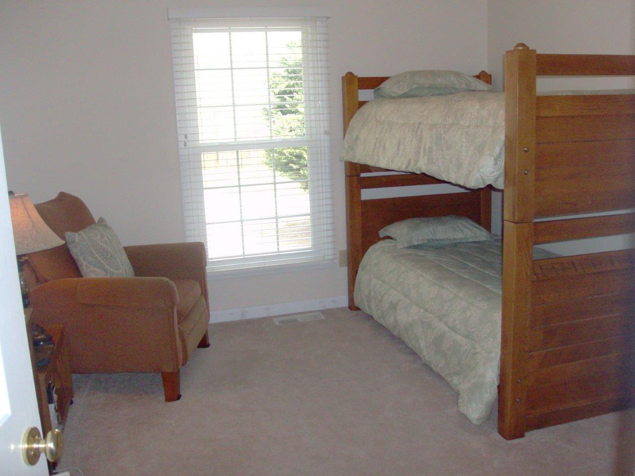 12929 Callaway Road Callaway, VA 24067 - Photo 5 of 59 a bed room with a bed and a chair