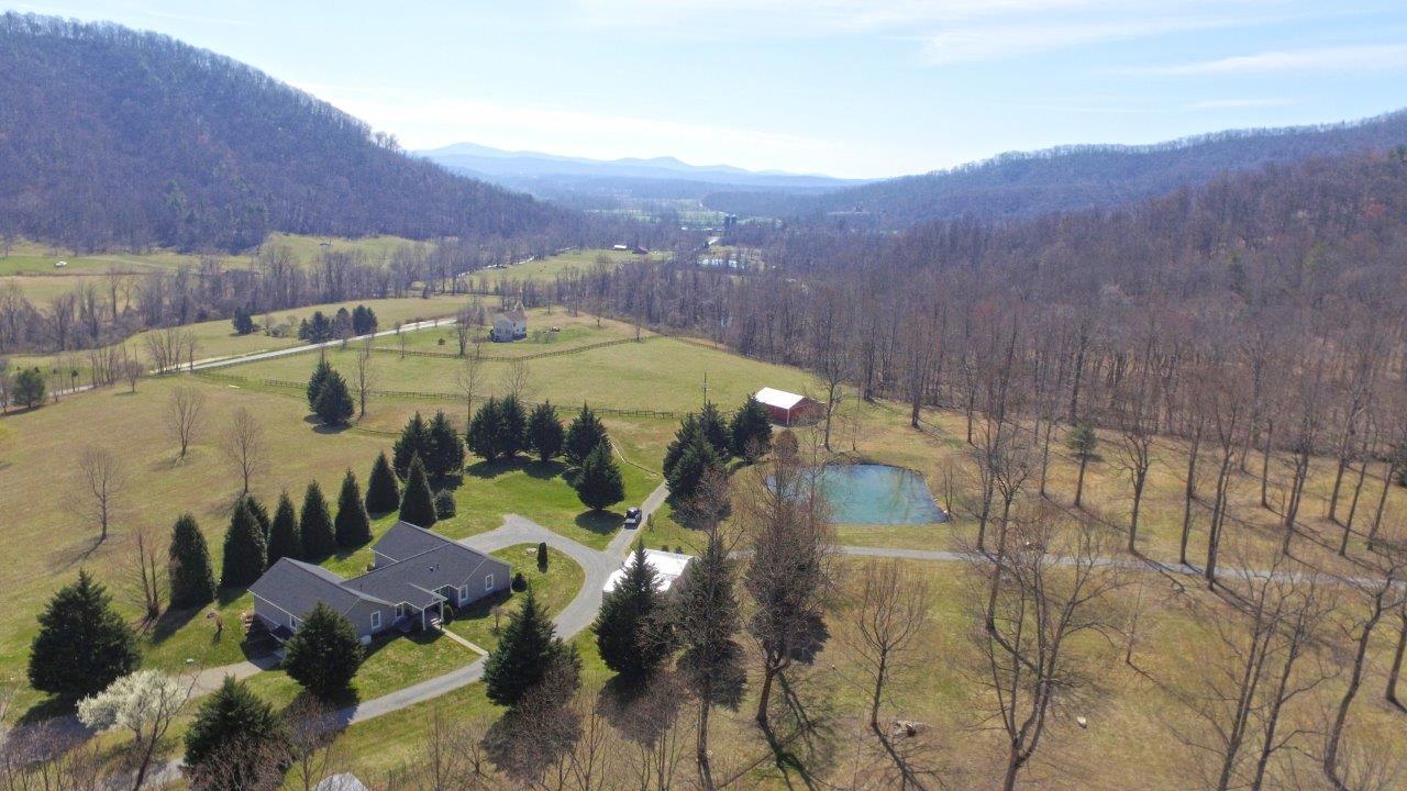 12929 Callaway Road Callaway, VA 24067 - Photo 51 of 59 a view of a swimming pool with a yard and mountain view