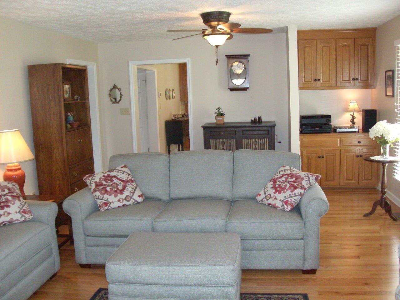 12929 Callaway Road Callaway, VA 24067 - Photo 6 of 59 a living room with furniture and a chandelier