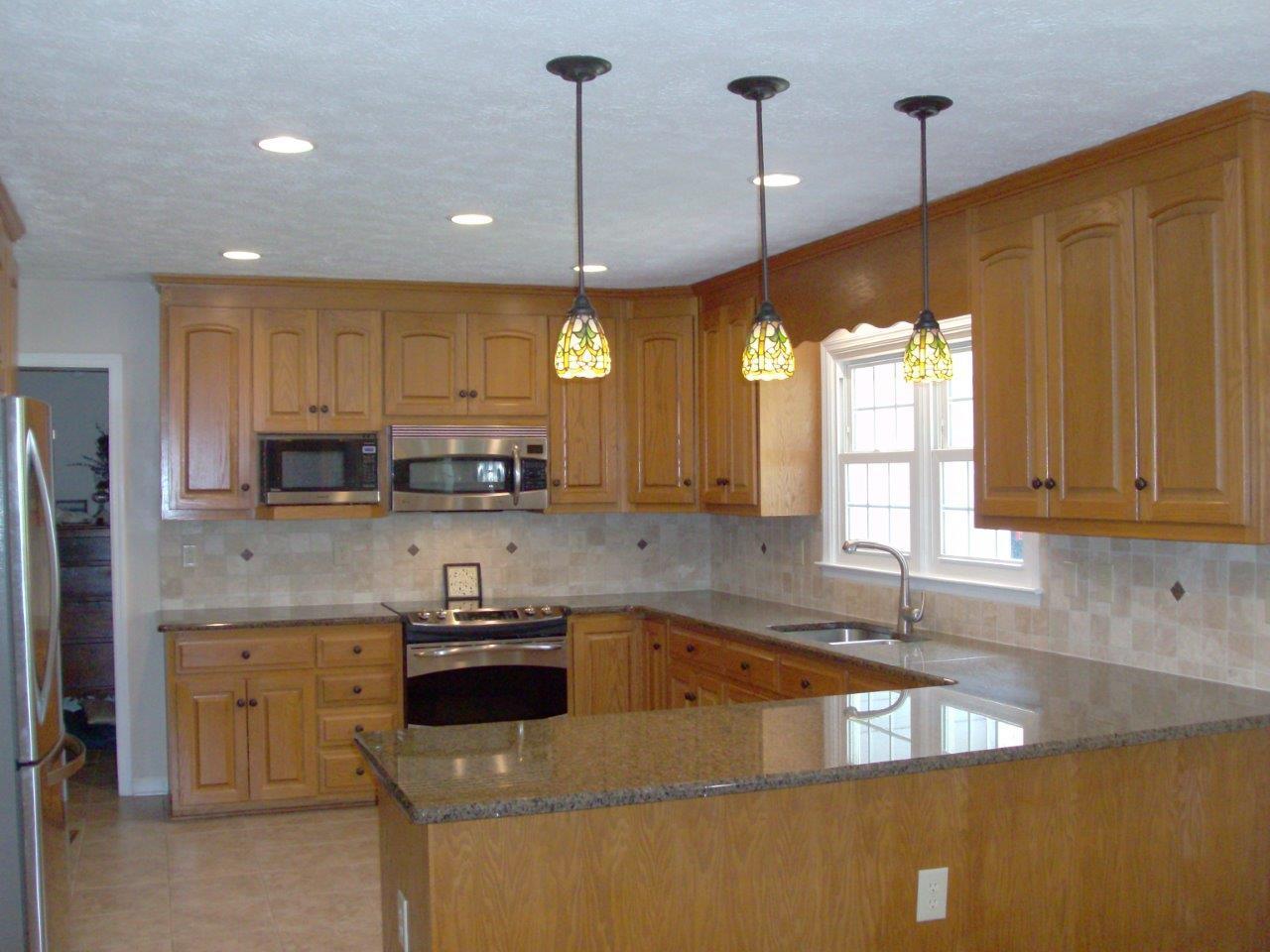 12929 Callaway Road Callaway, VA 24067 - Photo 7 of 59 a kitchen with stainless steel appliances granite countertop a sink a stove and a granite counter top