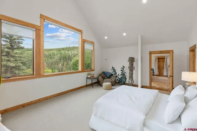 a bathroom with a granite countertop sink and a large mirror