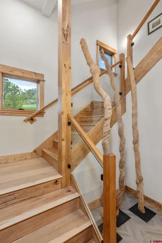 a bedroom with a large bed and a large window