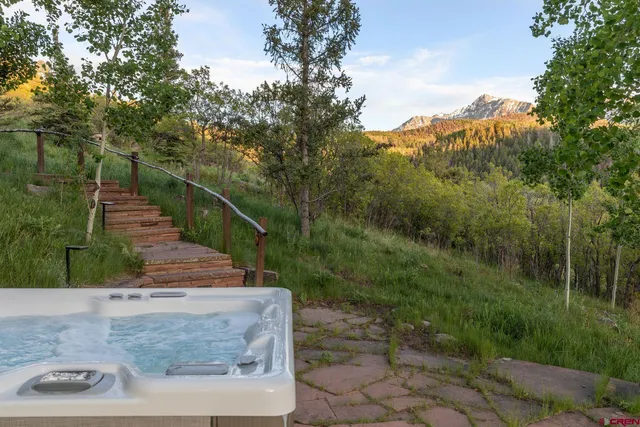 a living room with furniture potted plant and a window