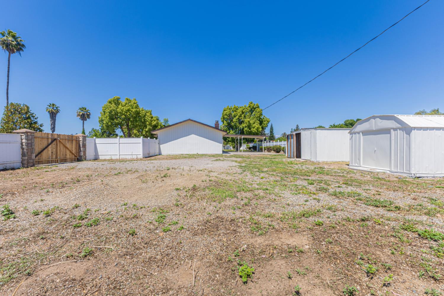 17925 Rodeo Drive Madera, CA 93638 - Photo 24 of 26 a view of a house with a yard and potted plants
