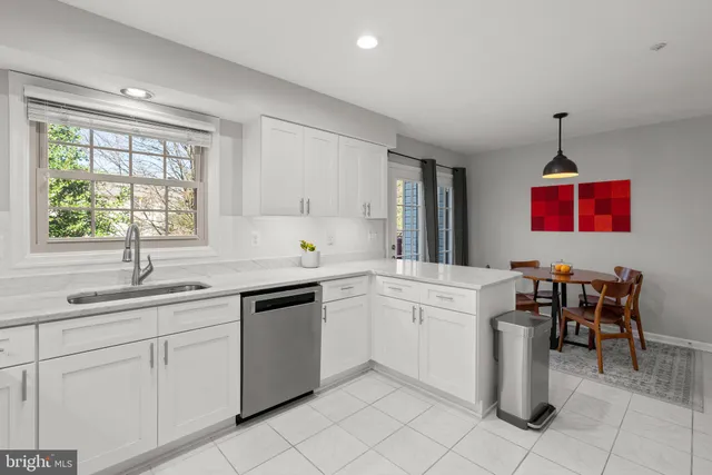a kitchen with sink cabinets and window