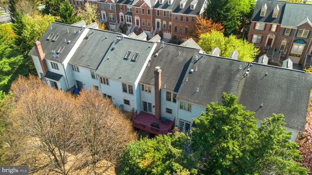 an aerial view of a house with a garden and plants