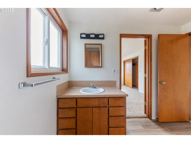 a bathroom with a toilet and a sink