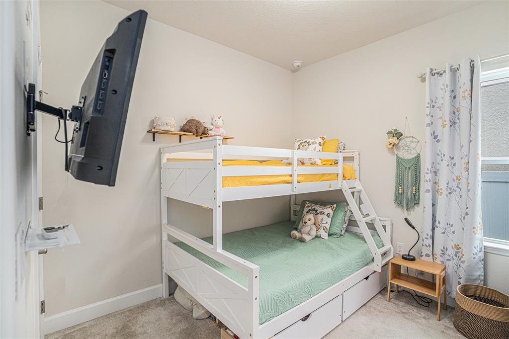 19056 Heavenside Ct Spring Hill Spring Hill, FL 34610 - Photo 16 of 25 a bedroom with a bed and a window