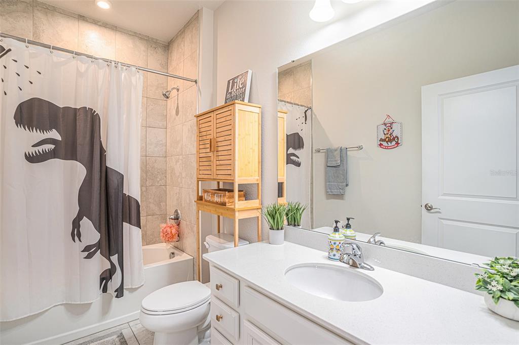 19056 Heavenside Ct Spring Hill Spring Hill, FL 34610 - Photo 17 of 25 a bathroom with a sink toilet and shower