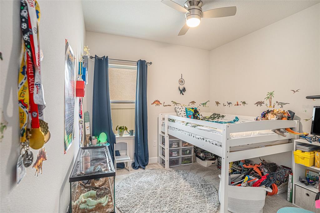 19056 Heavenside Ct Spring Hill Spring Hill, FL 34610 - Photo 18 of 25 a view of a workspace with furniture and toys