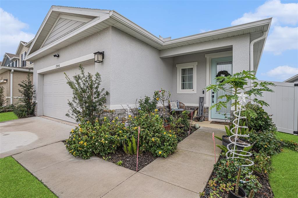 19056 Heavenside Ct Spring Hill Spring Hill, FL 34610 - Photo 2 of 25 a front view of a house with a yard