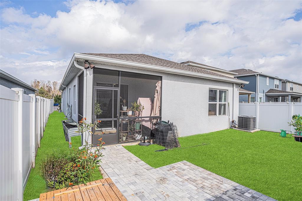 19056 Heavenside Ct Spring Hill Spring Hill, FL 34610 - Photo 22 of 25 a house view with a garden space and wooden fence