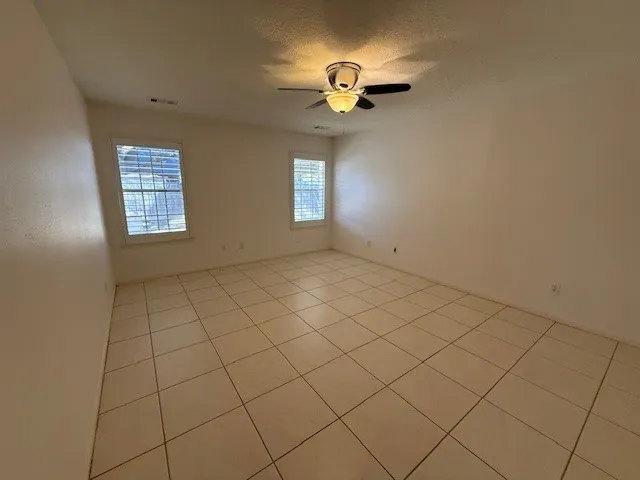 a bathroom with a shower and a mirror