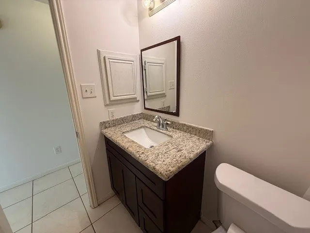 a view of an empty room and a window