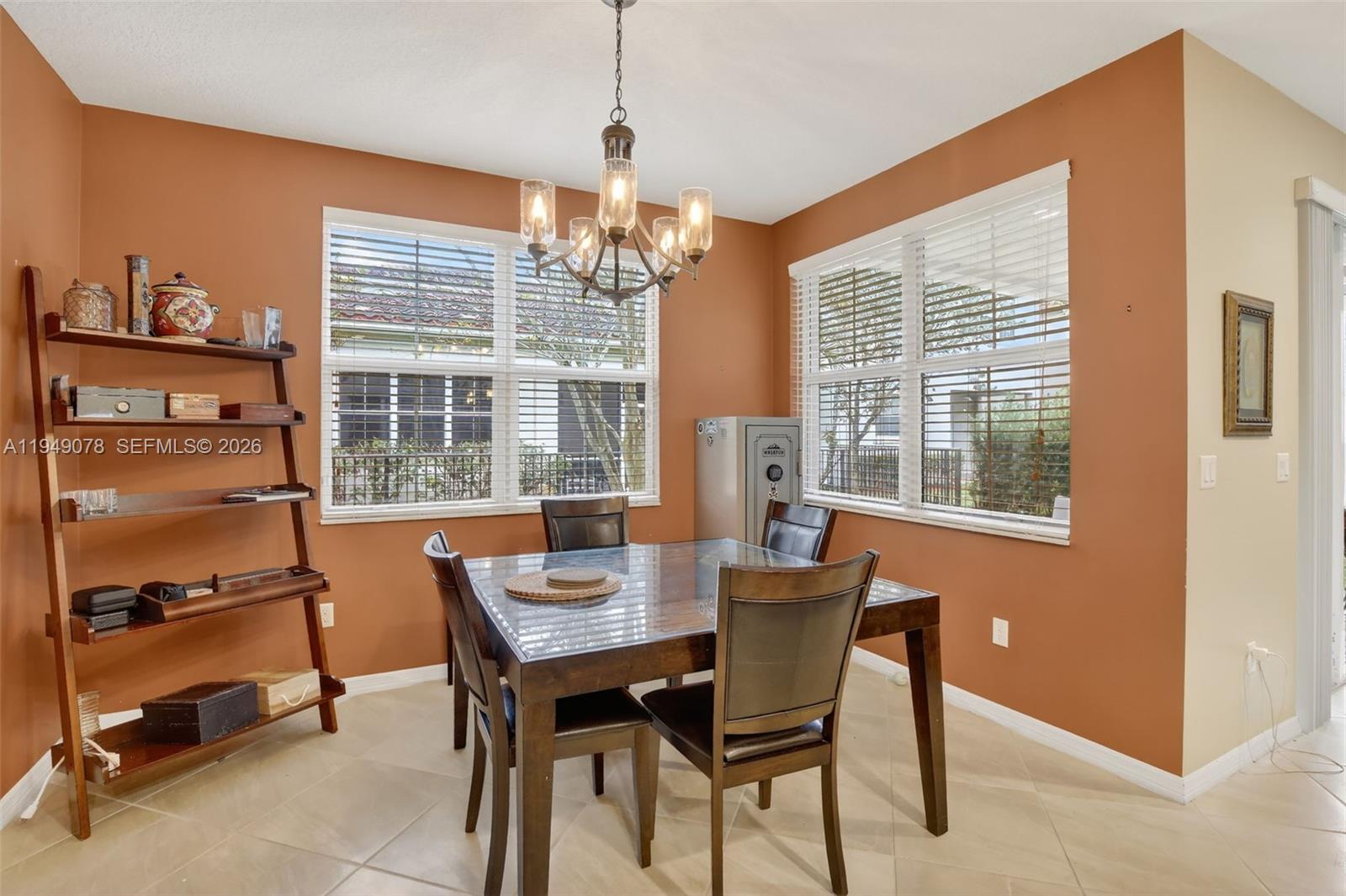 5208 Falcon Trail Davie, FL 33314 - Photo 17 of 49 a dining room with furniture a chandelier and window