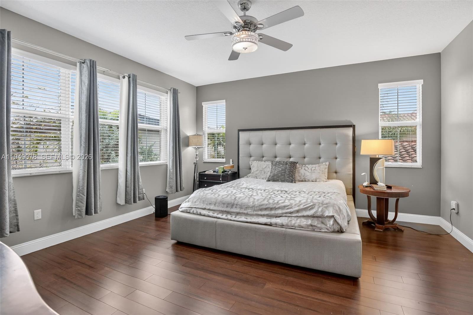 5208 Falcon Trail Davie, FL 33314 - Photo 19 of 49 a spacious bedroom with a bed and wooden floor