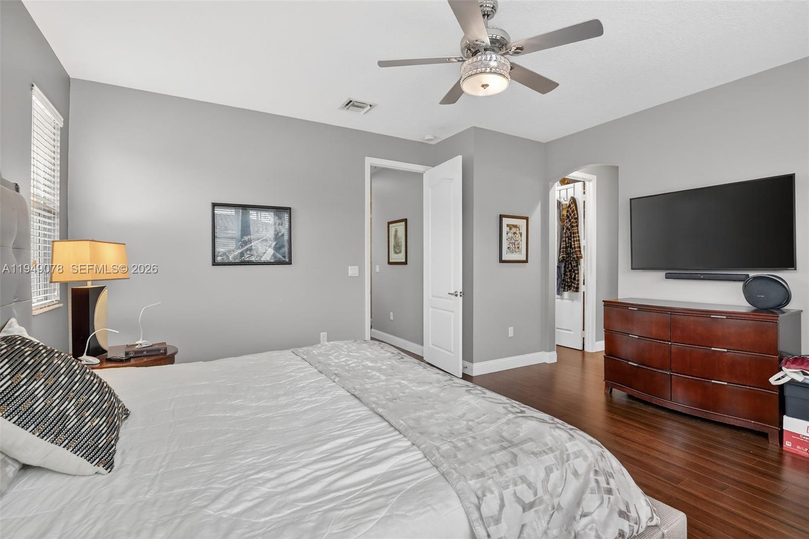 5208 Falcon Trail Davie, FL 33314 - Photo 21 of 49 a bedroom with a bed and a flat screen tv