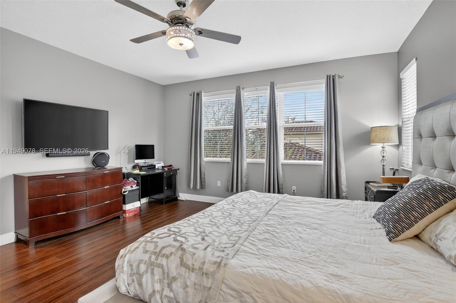 5208 Falcon Trail Davie, FL 33314 - Photo 22 of 49 a bedroom with a bed and a flat screen tv