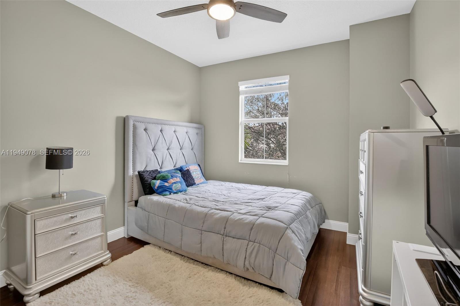 5208 Falcon Trail Davie, FL 33314 - Photo 26 of 49 a bedroom with a bed and a flat tv screen on dresser