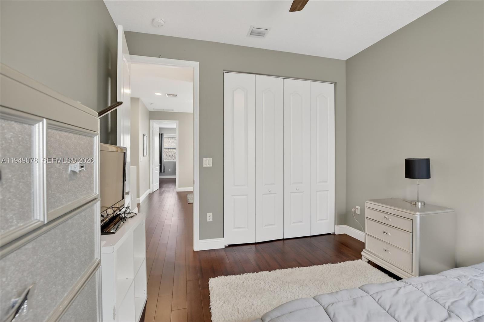 5208 Falcon Trail Davie, FL 33314 - Photo 27 of 49 a bedroom with a bed and a mirror