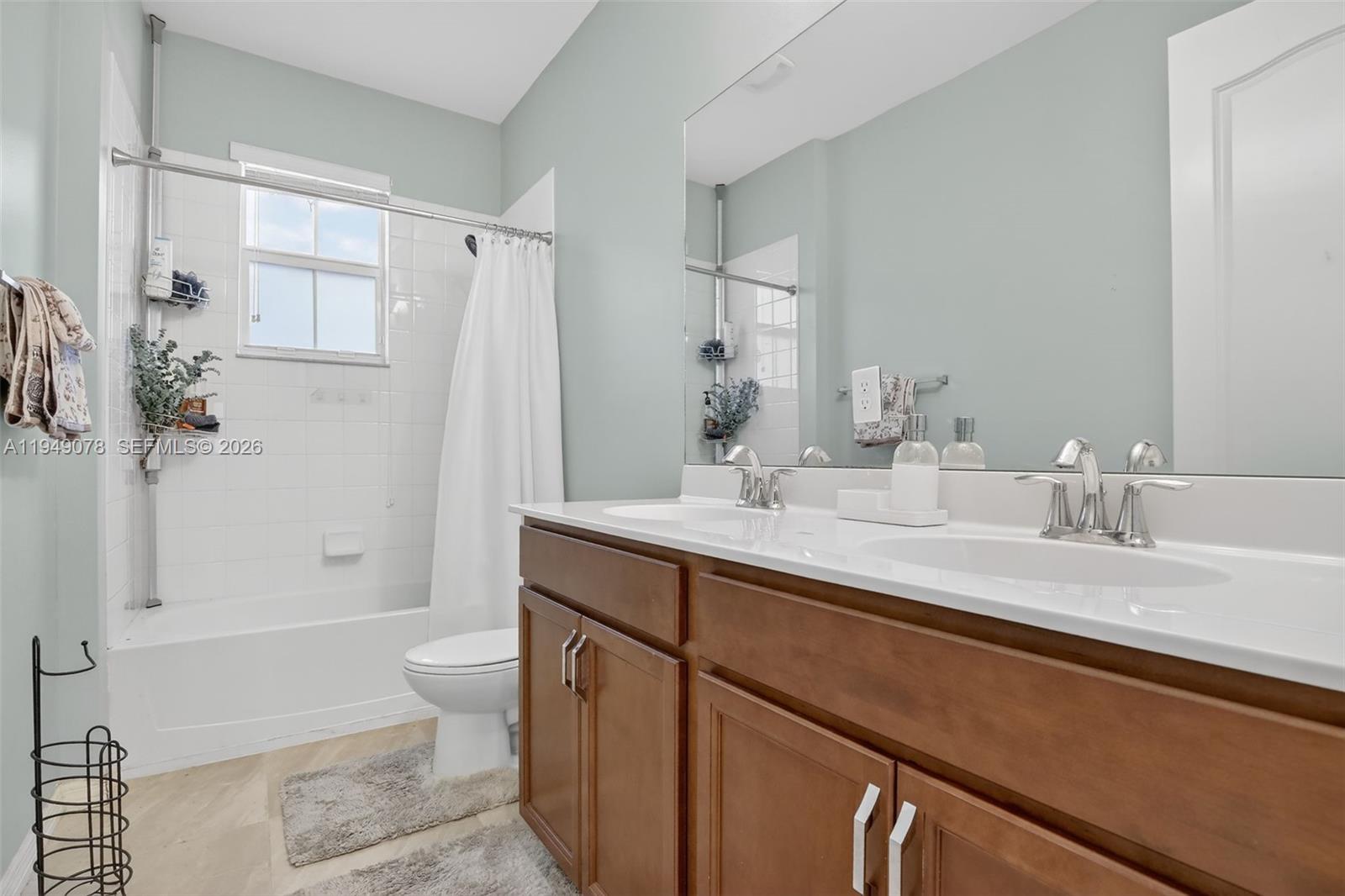 5208 Falcon Trail Davie, FL 33314 - Photo 28 of 49 a bathroom with a granite countertop sink toilet and shower