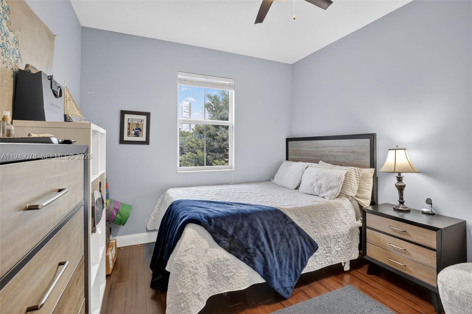 5208 Falcon Trail Davie, FL 33314 - Photo 29 of 49 a bedroom with a bed and a flat tv screen on a dresser