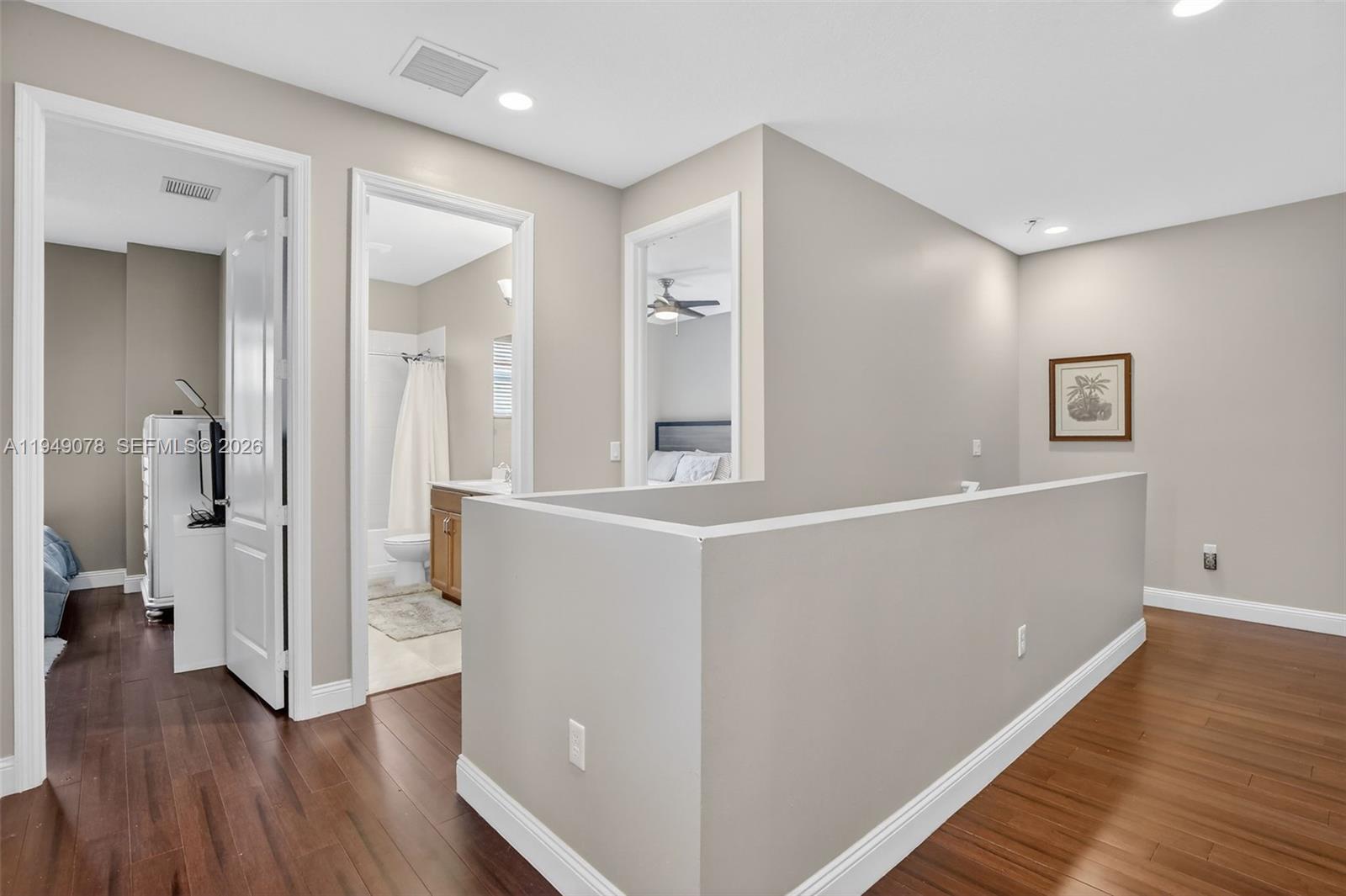 5208 Falcon Trail Davie, FL 33314 - Photo 31 of 49 a view of a hallway with wooden floor and cabinet
