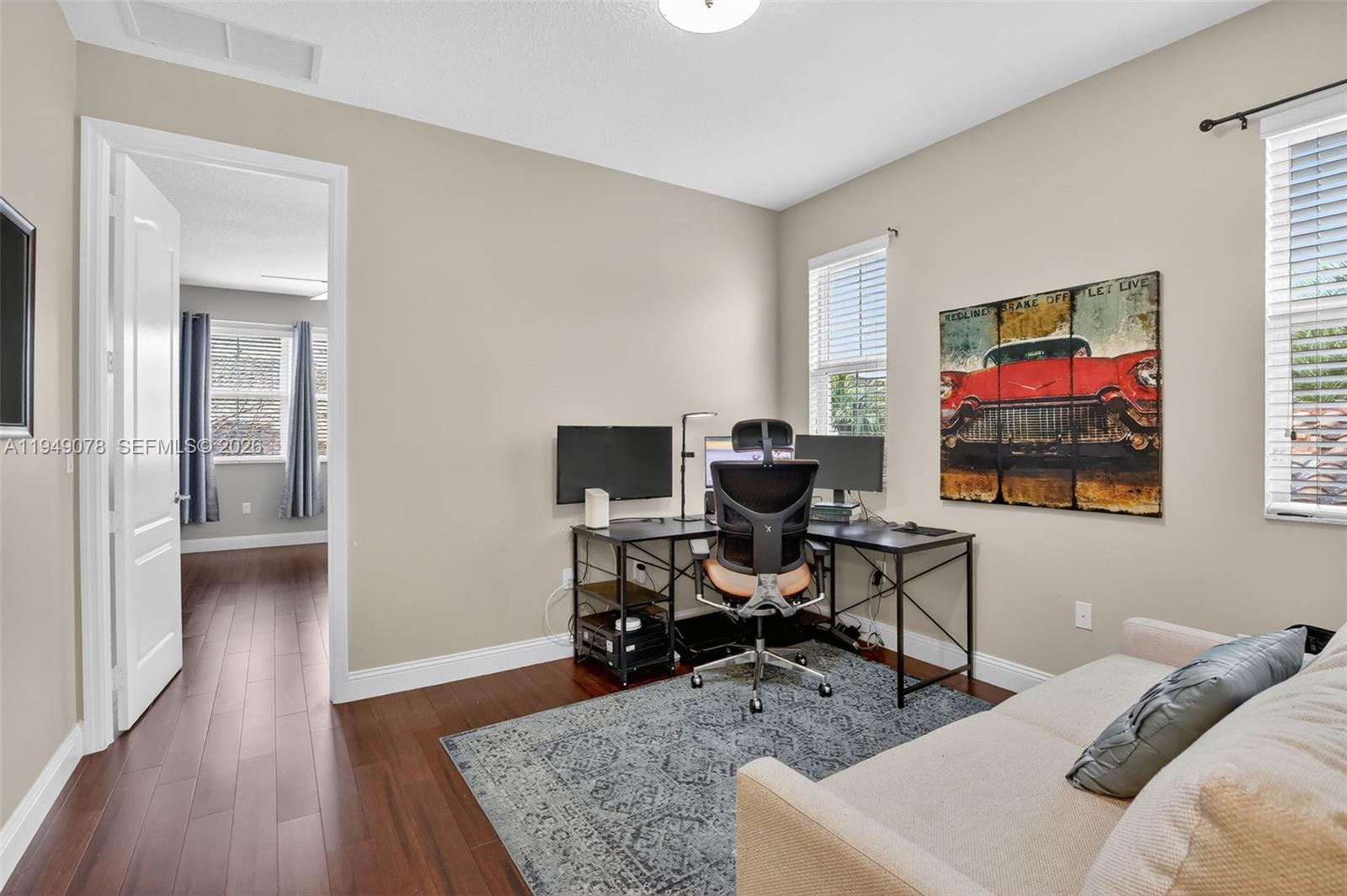 5208 Falcon Trail Davie, FL 33314 - Photo 32 of 49 a living room with furniture and a flat screen tv