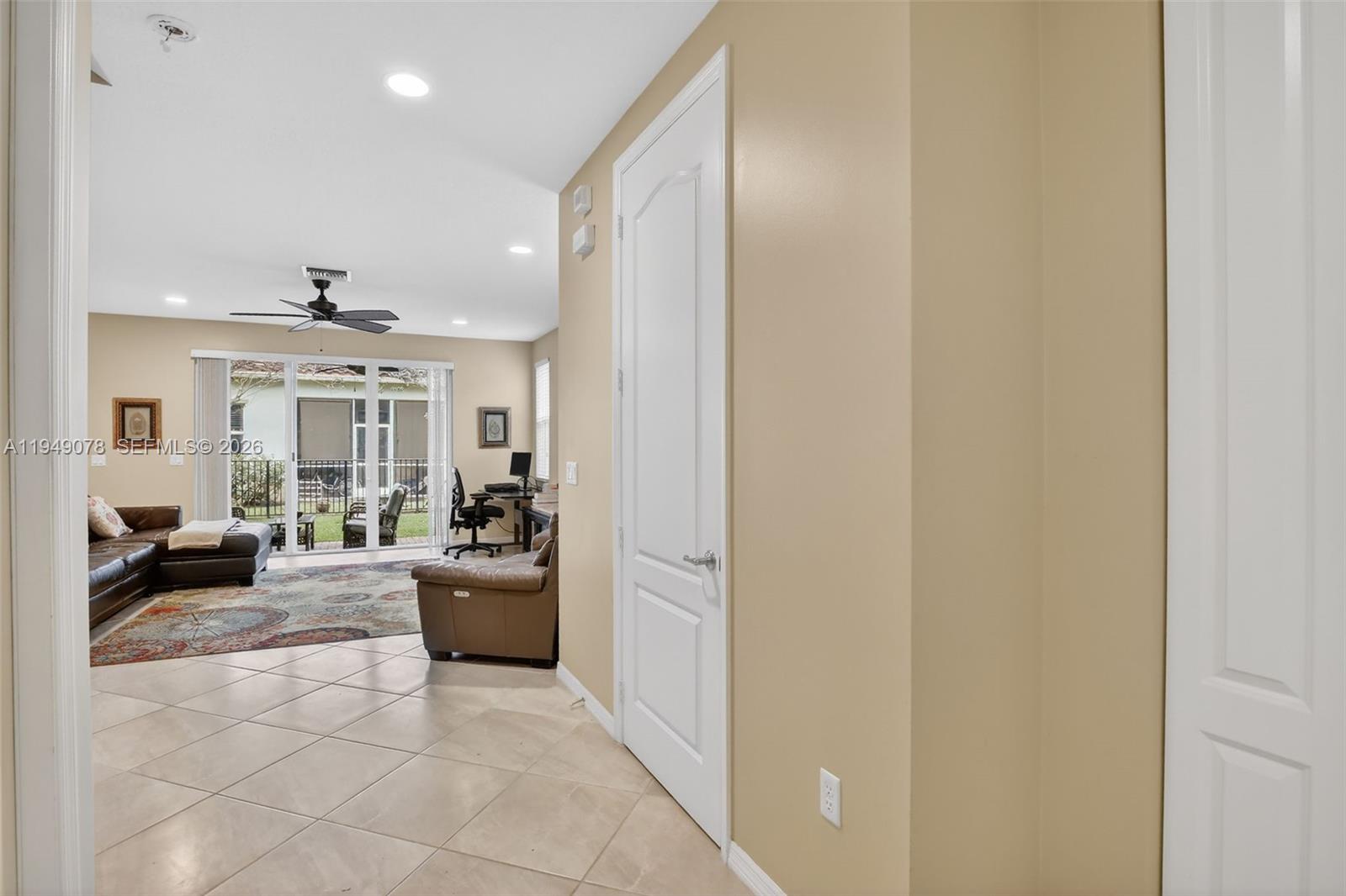 5208 Falcon Trail Davie, FL 33314 - Photo 4 of 49 a living room with furniture and a chandelier