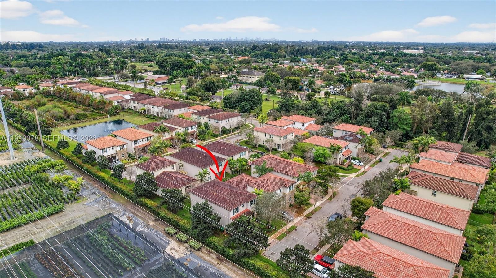 5208 Falcon Trail Davie, FL 33314 - Photo 42 of 49 an aerial view of a city with lots of residential buildings ocean and mountain view in back