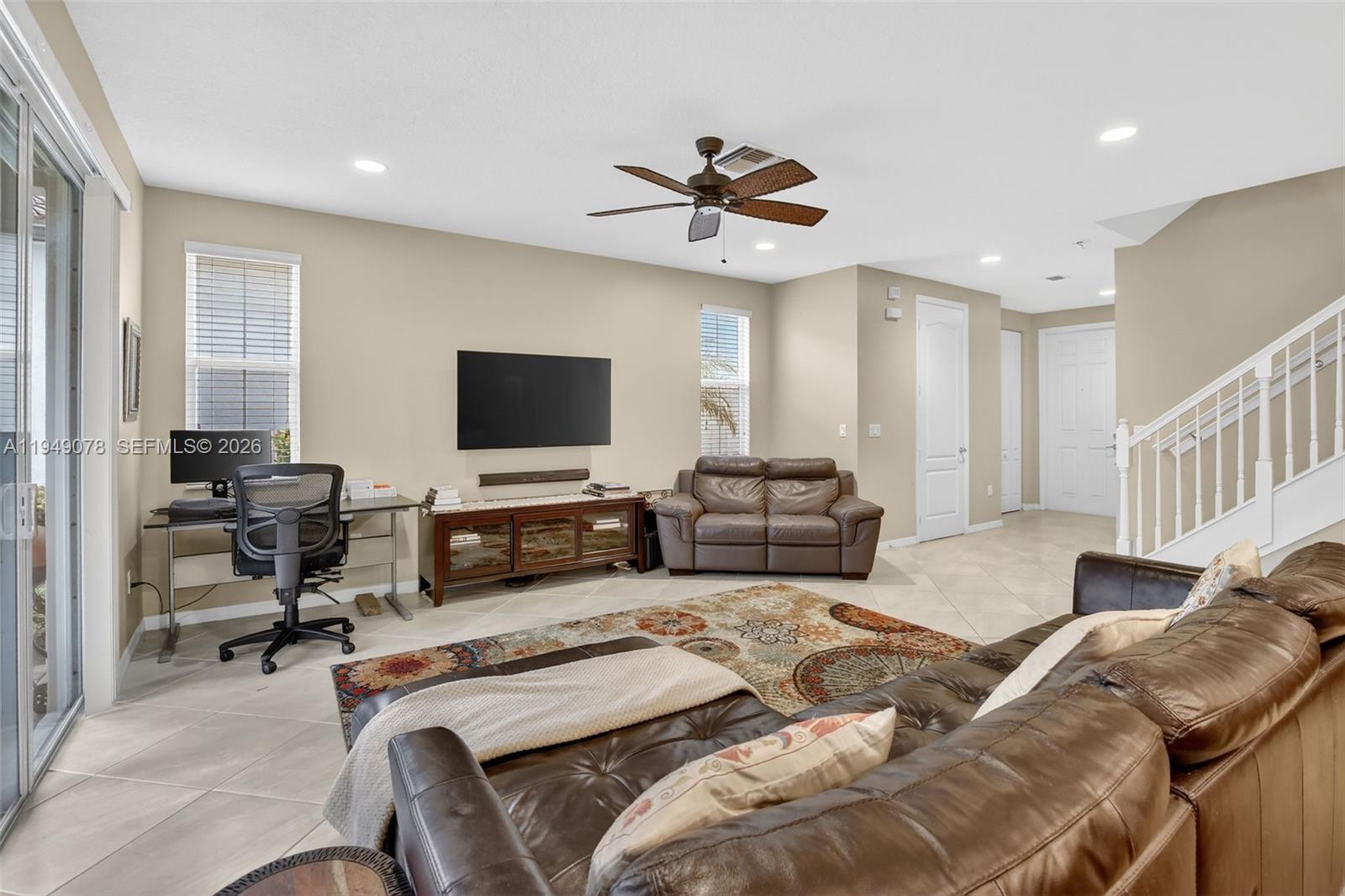 5208 Falcon Trail Davie, FL 33314 - Photo 9 of 49 a bedroom with furniture and a flat screen tv