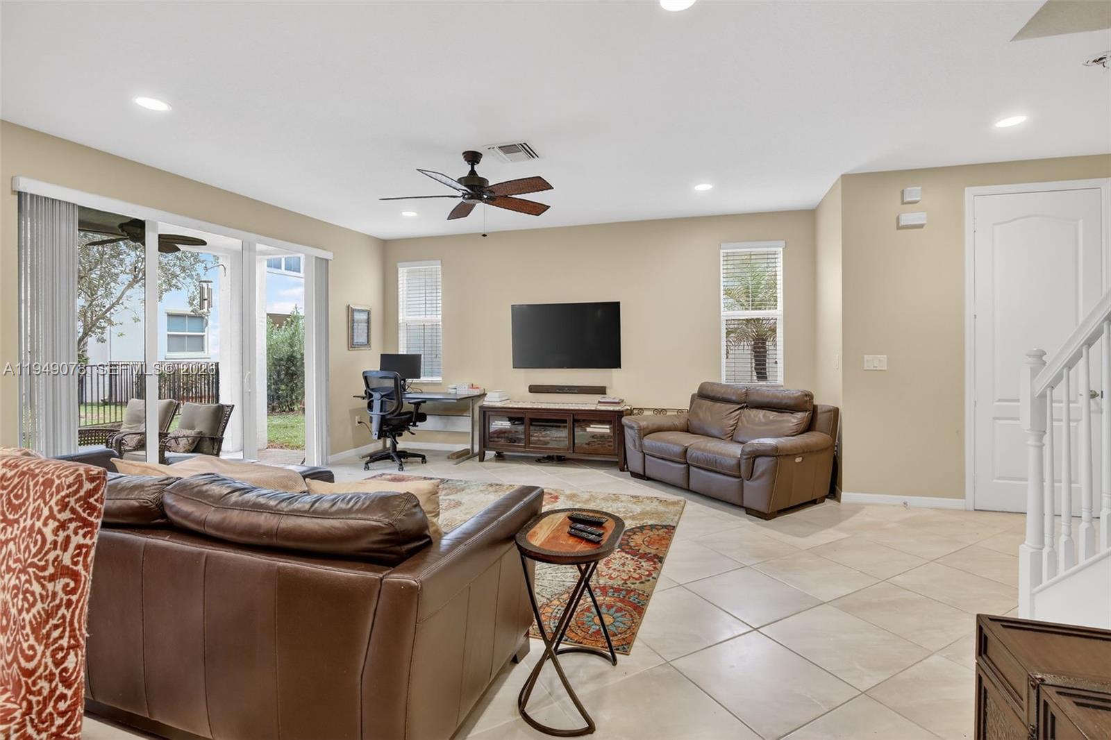 5208 Falcon Trail Davie, FL 33314 - Photo 10 of 49 a living room with furniture and a flat screen tv