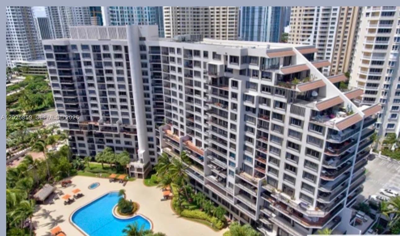 540 Brickell Key Drive, Unit 1024 Miami, FL 33131 - Photo 28 of 28 a front view of a building with a yard