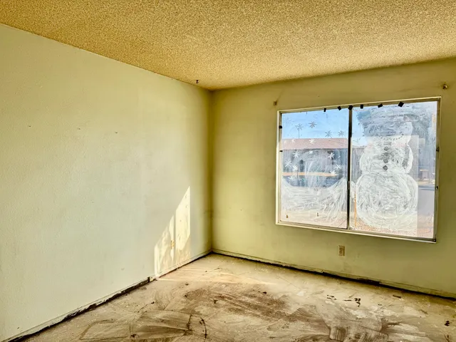a view of a room with wooden floor and cabinet