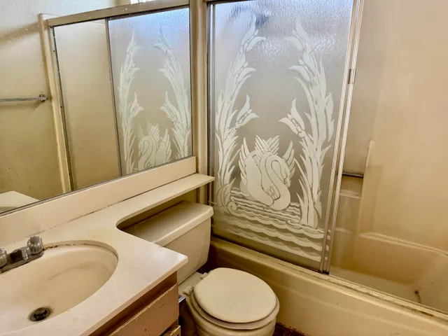 a bathroom with a sink and toilet