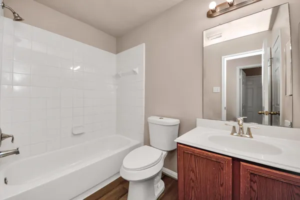 a bathroom with a sink toilet and bathtub