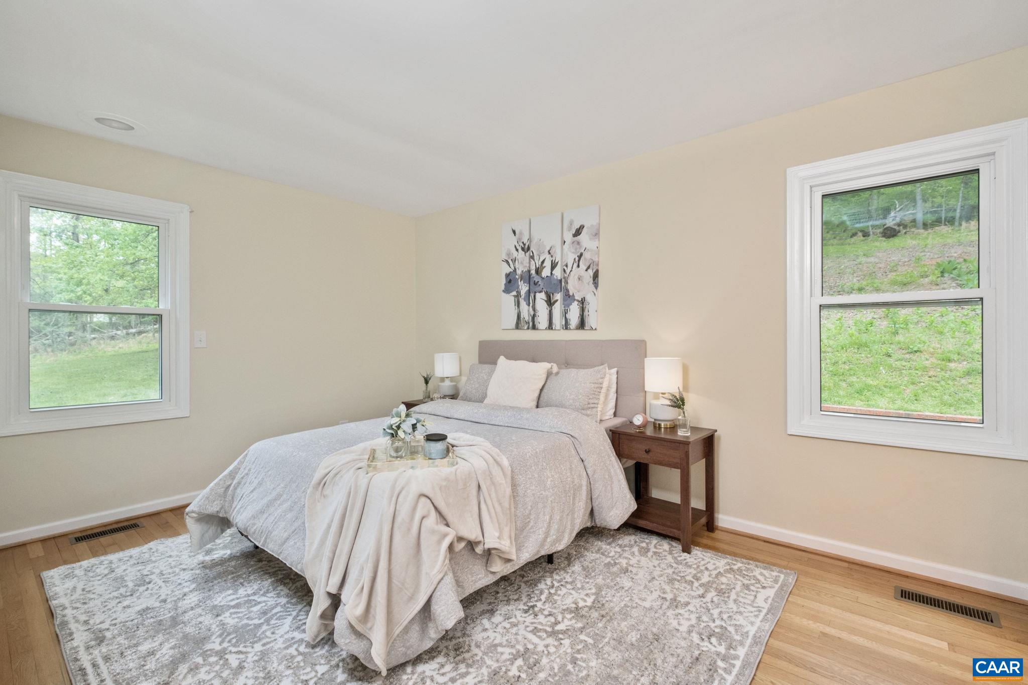 1680 Craigs Store Road Afton, VA 22920 - Photo 35 of 57 a bed sitting in a bedroom next to a window