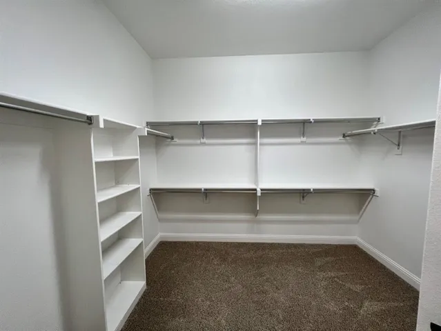 a view of an empty walk in closet
