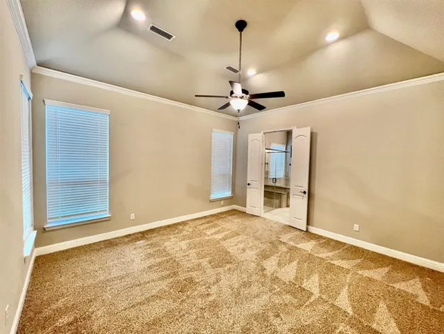 a view of an empty room with a chandelier