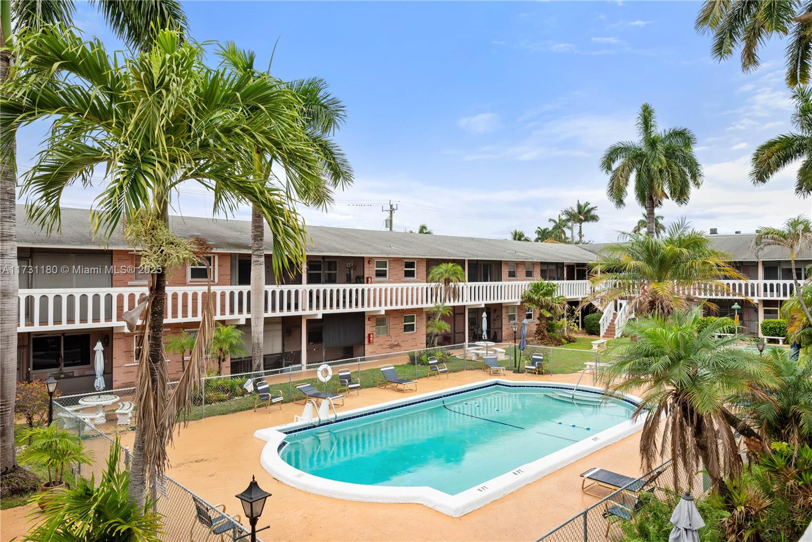 160 Northeast 8th Avenue, Unit 9B Hallandale Beach, FL 33009 - Photo 15 of 25 a view of a house with swimming pool and sitting area