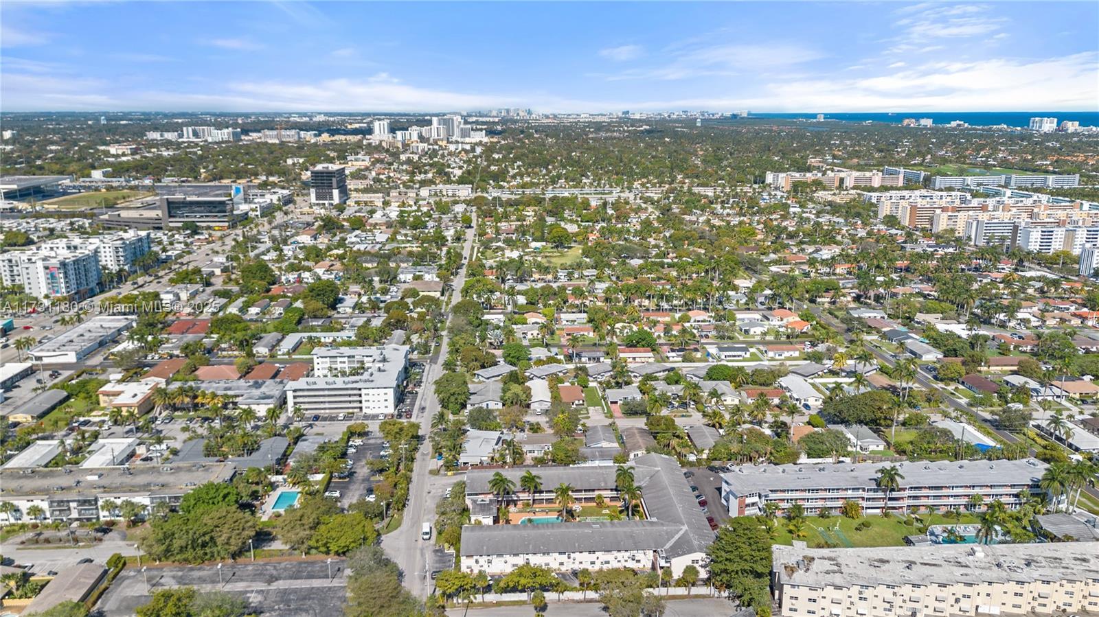 160 Northeast 8th Avenue, Unit 9B Hallandale Beach, FL 33009 - Photo 24 of 25 an aerial view of residential building with parking space