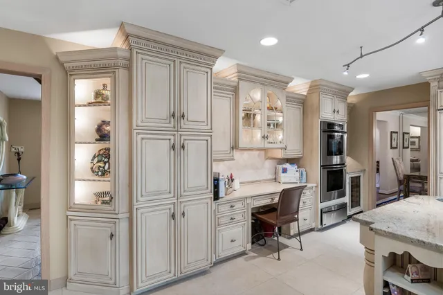 a kitchen with a stove a sink a refrigerator and window