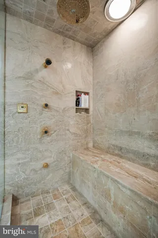 a bathroom with a granite countertop sink mirror and vanity