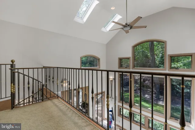a living room with furniture and a book shelf