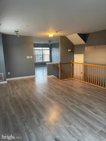 a view of a livingroom with furniture and wooden floor