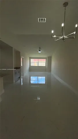 a view of a kitchen with marble kitchen and a sink